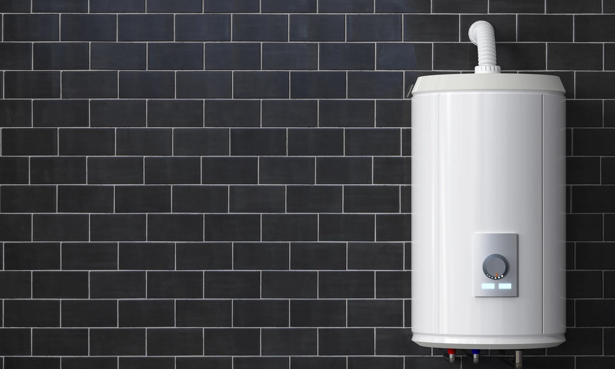 A white water heater mounted on a black tiled wall, expertly installed by Eric Sabo, guarantees efficient heating for your home.